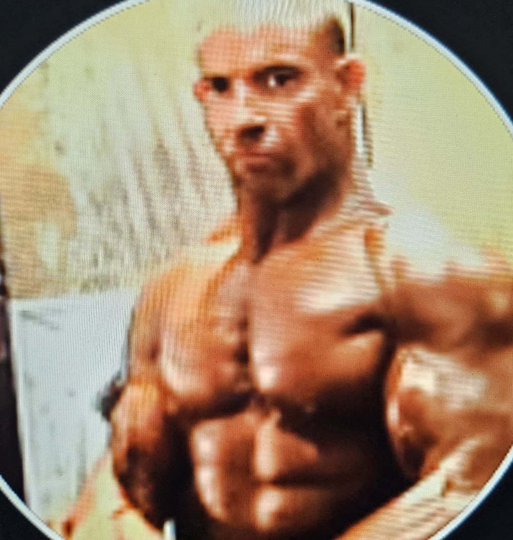 Todd Mendelsohn in a side chest pose backstage, archive photograph